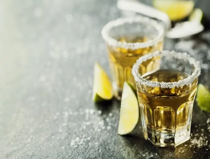 A tequila shot with lime and sea salt.